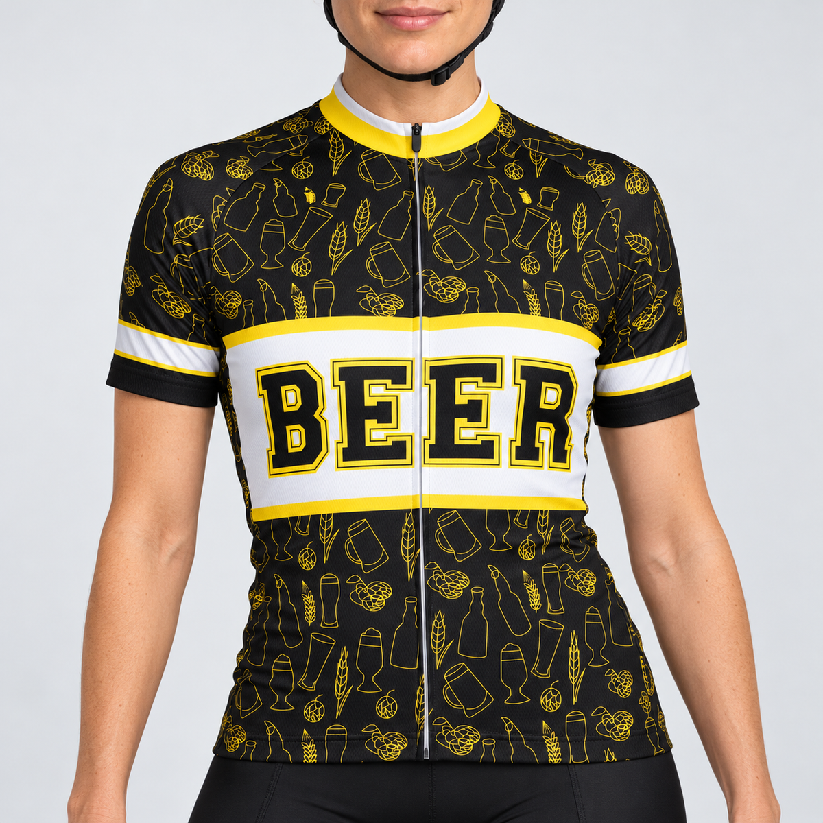 Female model wearing the black, white and yellow short-sleeve Beer cycling jersey with BEER lettering and beer-themed line graphics, shown from the lower lip and chin down with black cycling shorts against a light grey studio background.