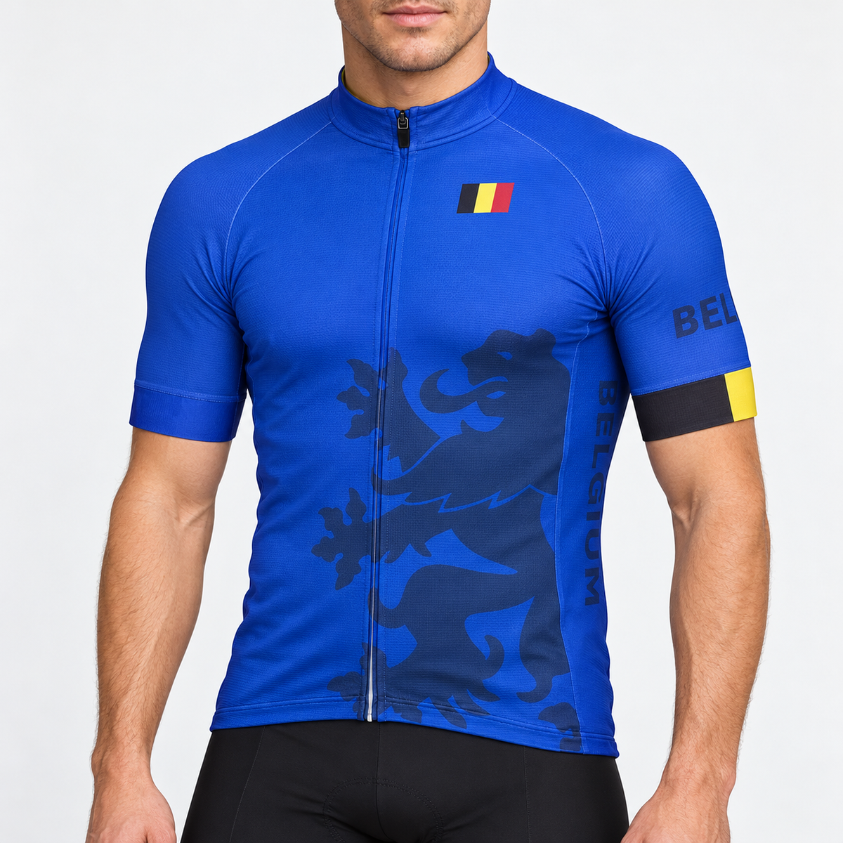 Male model wearing the blue short-sleeve Belgium cycling jersey with dark lion graphic, Belgian flag and black cycling shorts, shown from the lower lip down against a neutral studio background.