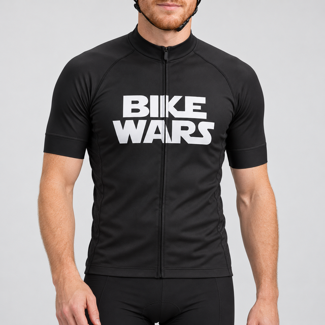 Male model wearing the black short-sleeve Bike Wars cycling jersey with white BIKE WARS lettering and black cycling shorts, shown from the lower lip down against a neutral studio background.