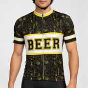 Male model wearing the black, white and yellow short-sleeve Beer cycling jersey with BEER lettering and beer-themed line graphics, shown from the lower lip down with black cycling shorts against a neutral studio background.