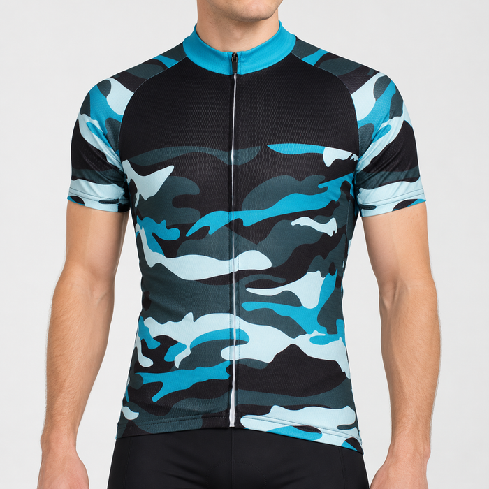 Male model wearing the short-sleeve Blue Camouflage cycling jersey with turquoise collar and blue, grey and black camouflage pattern, shown from the chin down with black cycling shorts against a neutral studio background.