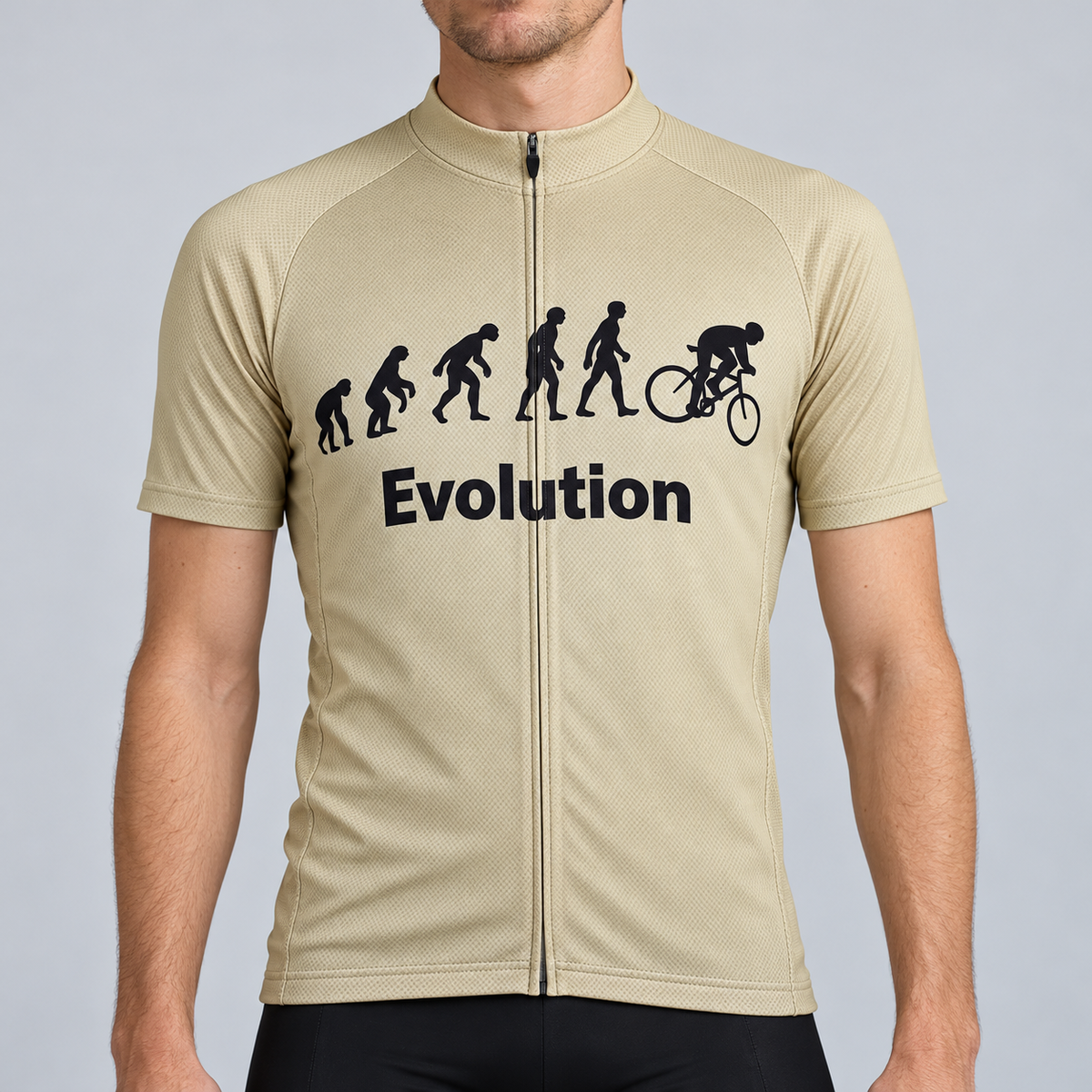 Male model wearing the beige Evolution Of Man short-sleeve cycling jersey with black evolution silhouettes, cyclist graphic and Evolution wording, shown from the chin down against a neutral studio background.