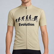 Male model wearing the beige Evolution Of Man short-sleeve cycling jersey with black evolution silhouettes, cyclist graphic and Evolution wording, shown from the chin down against a neutral studio background.
