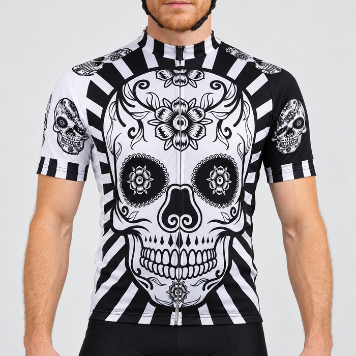 Male model wearing the black and white short-sleeve Flower Skull Print cycling jersey with floral skull graphics and striped trim, shown from the lower lip down with black cycling shorts against a neutral studio background.