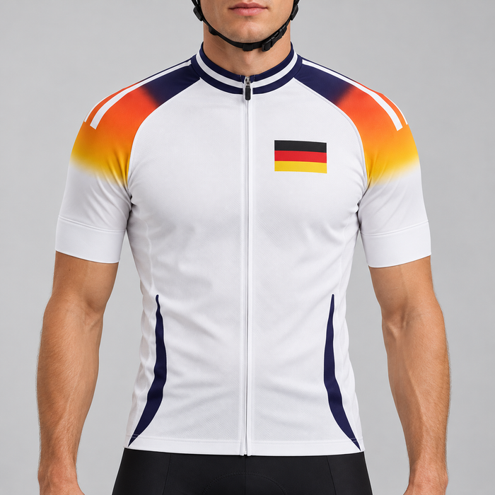 Male model wearing the white short-sleeve Germany 2024 Football Inspired cycling jersey with German flag, black-red-gold shoulder gradient and navy detailing, shown from the chin down with black cycling shorts against a neutral studio background.