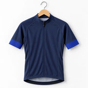 GG BASICS Blue With Light Blue Sleeve Cycling Jersey hanging on a hanger