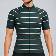Female model wearing the dark green short-sleeve GG BASICS Green Hoops cycling jersey with cream and burgundy horizontal stripes, shown with black cycling shorts against a light grey studio background.