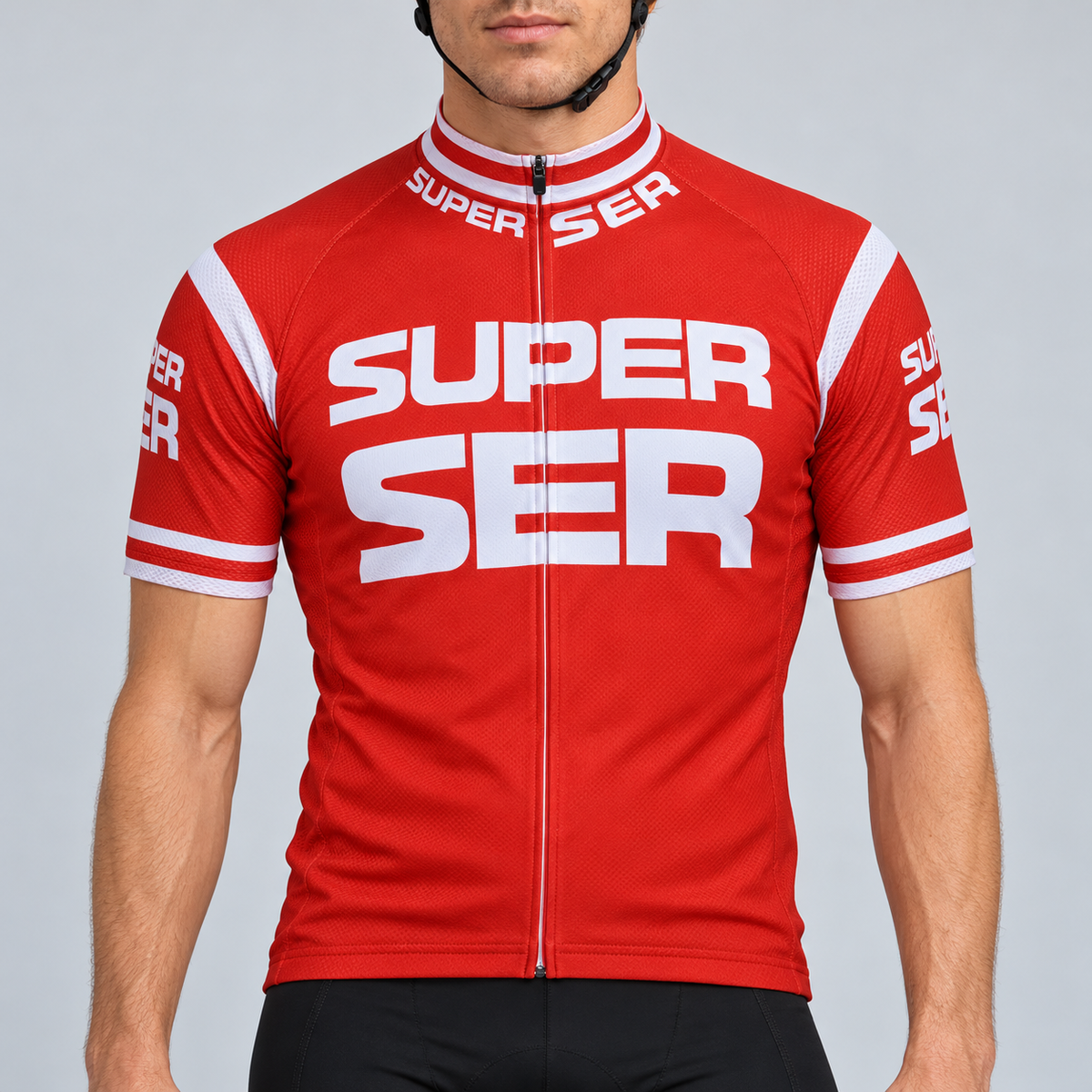 Male model shown from the chin down wearing the red Retro Super Ser short-sleeve cycling jersey with large white Super Ser lettering against a light grey studio background.