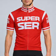 Male model shown from the chin down wearing the red Retro Super Ser short-sleeve cycling jersey with large white Super Ser lettering against a light grey studio background.