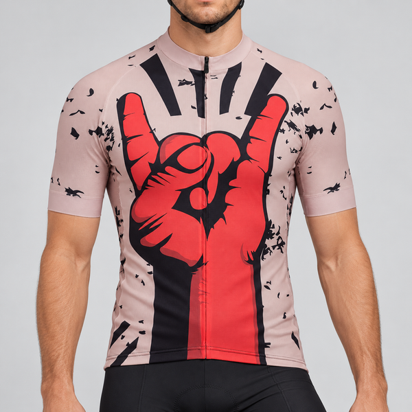 Male model shown from the chin down wearing the dusty pink Rock On short-sleeve cycling jersey with a large red and black hand graphic against a light grey studio background.