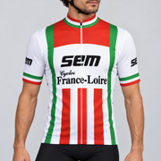 Male model shown from the chin down wearing the white, red and green Retro Sem France-Loire short-sleeve cycling jersey against a light grey studio background.